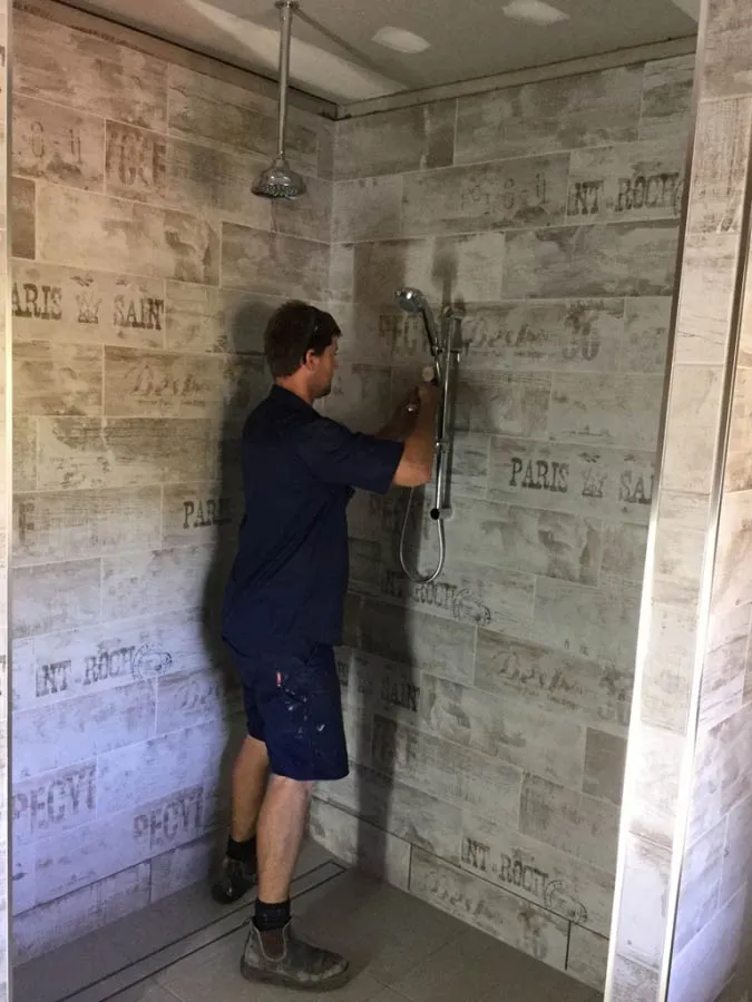 Plumber following health and safety procedures